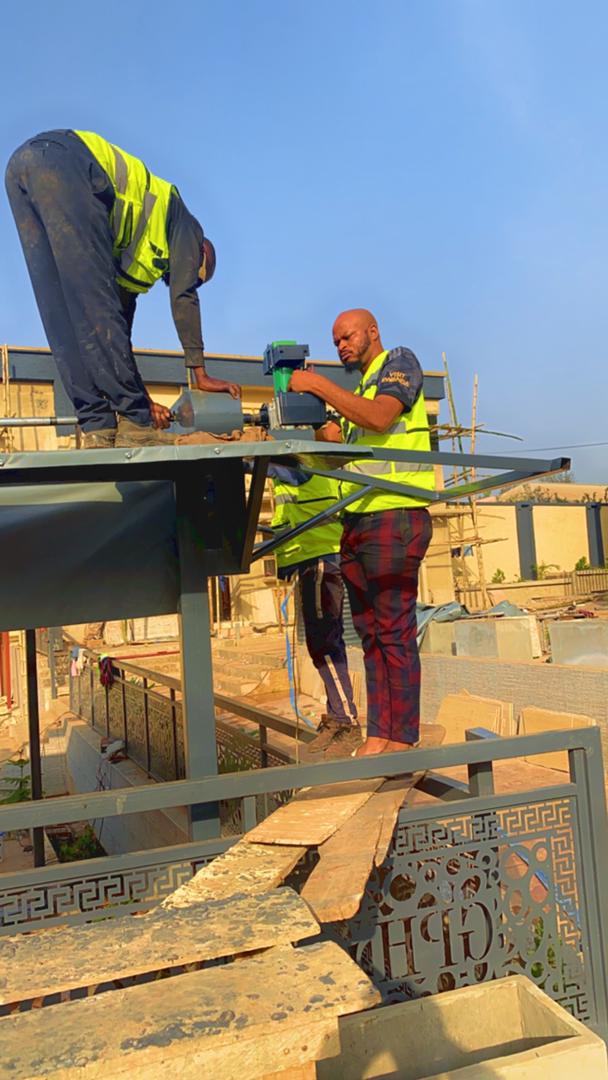 Access Innovations team fabricating custom gate, Lagos Nigeria